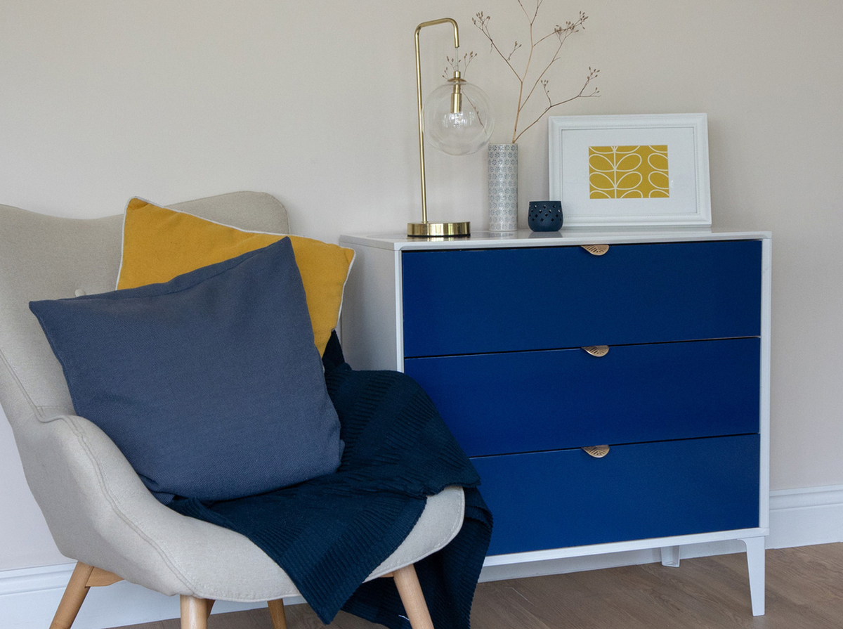 Dresser with drawer fronts re-covered and upcycled with d-c-fix® Navy Blue adhesive foil.