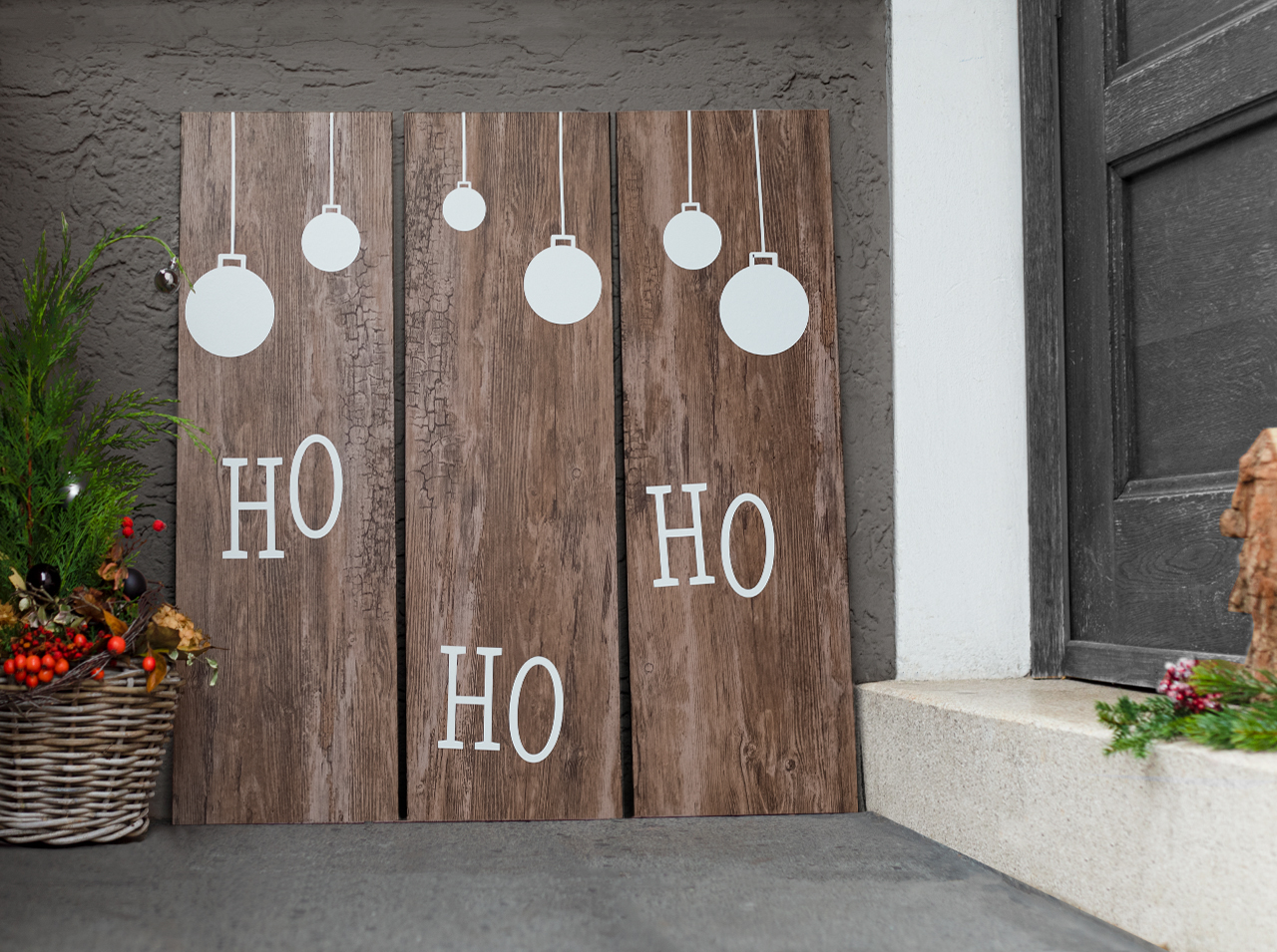 Three wooden slats covered with d-c-fix® Rustic adhesive foil in a rustic wood look and decorated with Christmas ornaments made of white adhesive foil.