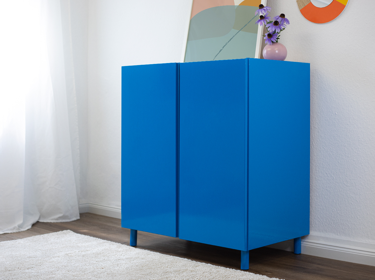 Plain color chest of drawers covered with d-c-fix® Airblue light blue adhesive foil