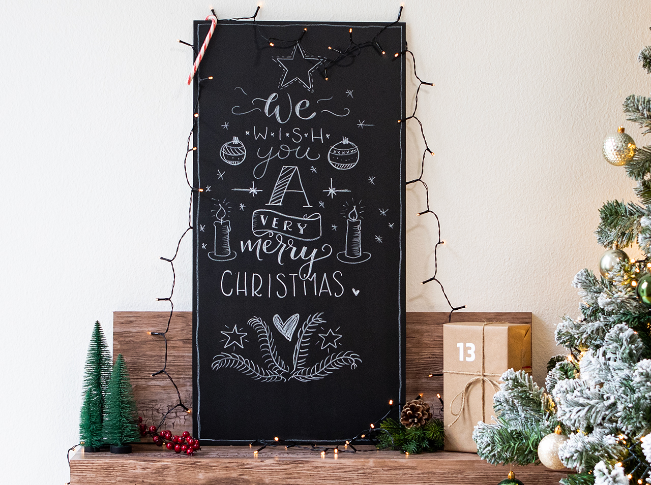 Large board covered with chalkboard foil written and drawn on using a chalk pen.